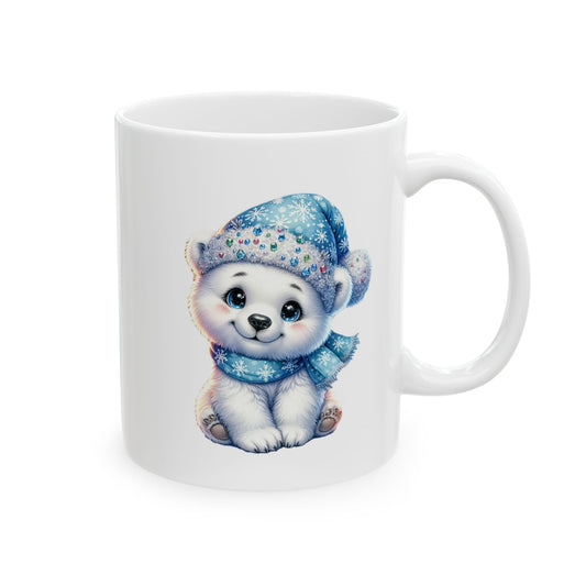 White ceramic coffee mug printed with an illustration of a cute white polar bear cub in a blue snowflake beanie holding a small steamy mug of coffee