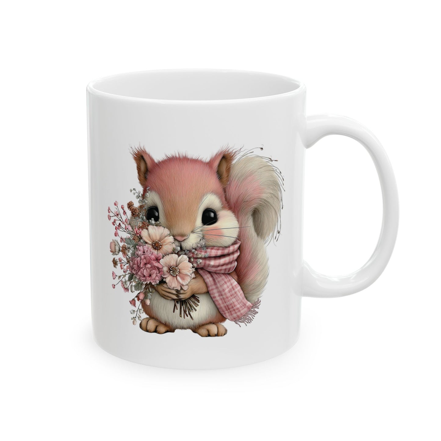 Cute fluffy squirrel wearing a pink plaid scarf holding a bouquet of pink flowers on a ceramic coffee mug