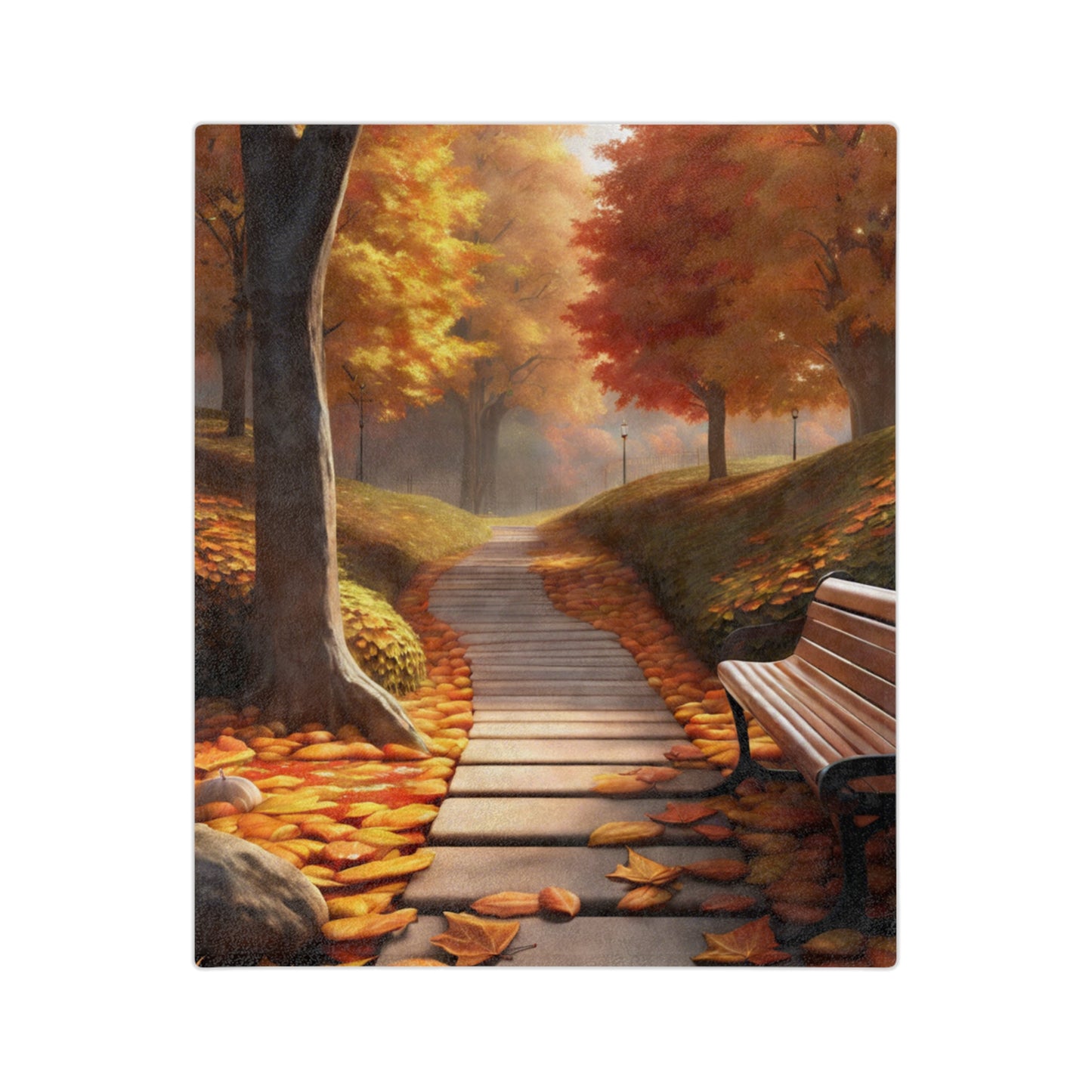 Lightweight velveteen blanket depicting an autumn park scene with a wooden path, colorful fall leaves covering the ground, and a brown park bench surrounded by trees.

