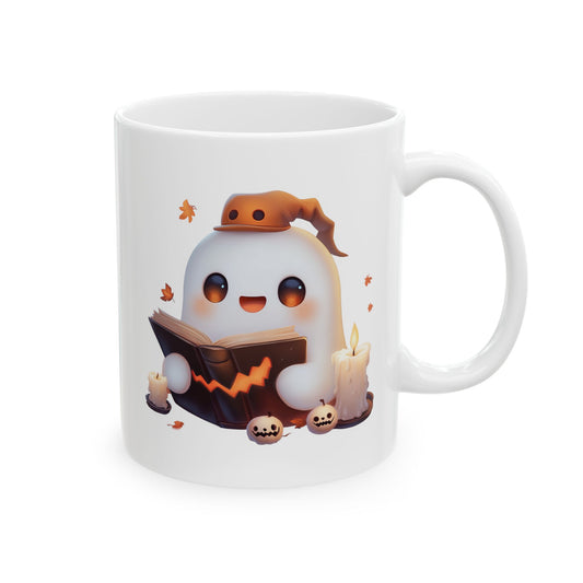 White ceramic coffee mug featuring an adorable cartoon ghost wearing an orange hat and reading a dark spellbook with a glowing jack-o'-lantern face, surrounded by lit candles and mini pumpkins.
