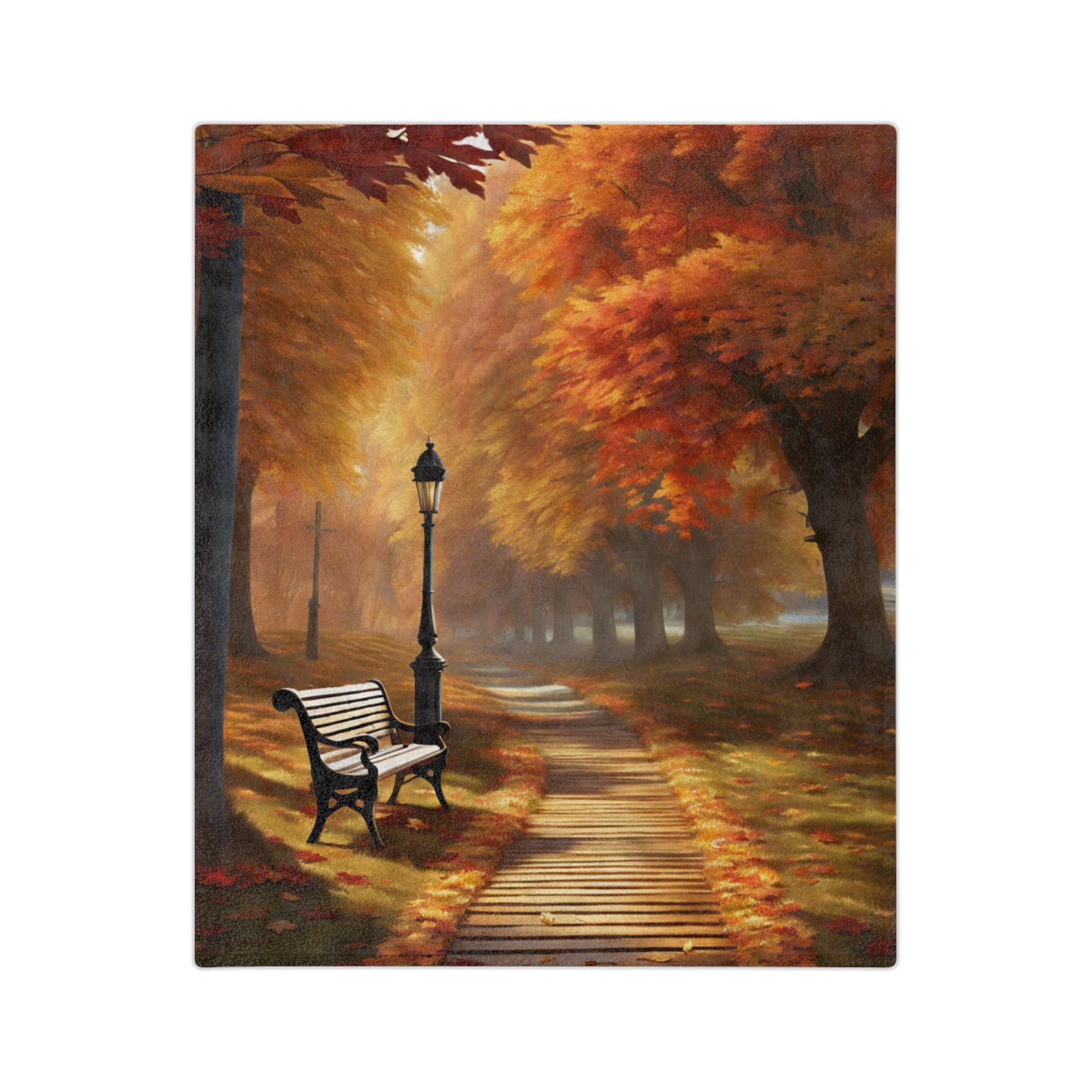 Lightweight velveteen blanket depicting an autumn park scene with a winding wooden path, a black streetlamp, a park bench, and trees with vibrant orange and red fall leaves.

