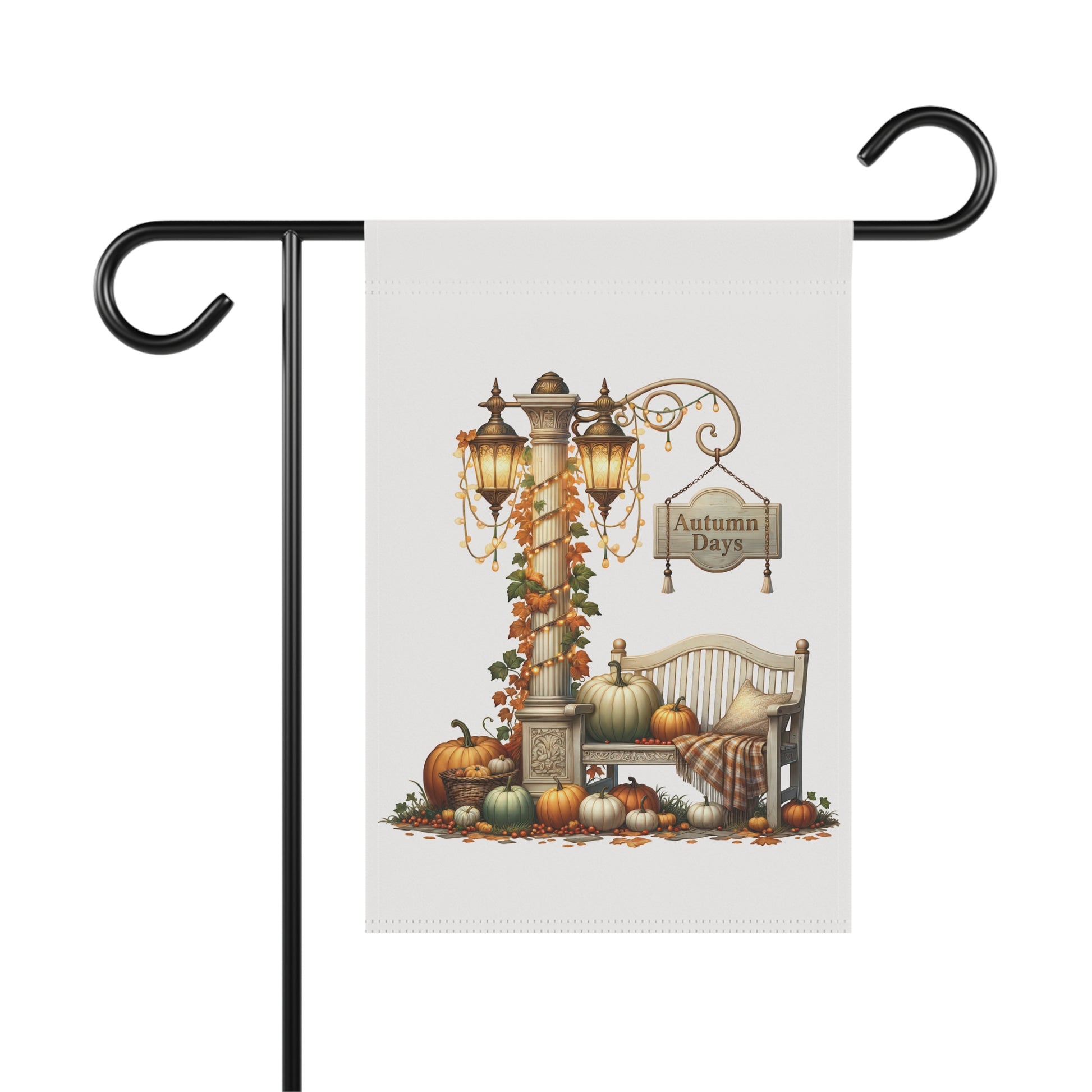 Elegant autumn garden flag featuring a double-headed vintage lamppost wrapped in fairy lights and autumn leaves, an Autumn Days sign, and a park bench styled with a plaid blanket and various pumpkins.
