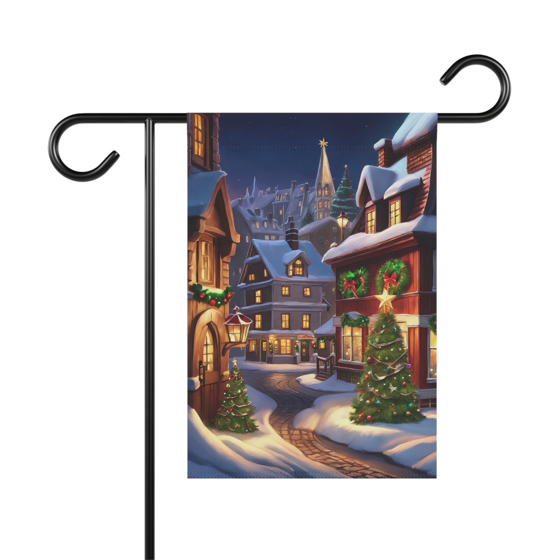 Enchanting Christmas village street garden flag with snow-covered houses, decorated Christmas trees, and glowing lights, on a black metal garden flag stand.

