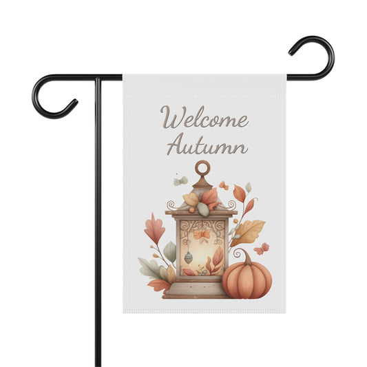 Outdoor garden flag featuring a whimsical lantern illustration beneath taupe script text reading Welcome Autumn.