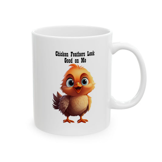 White ceramic coffee mug with a cartoon illustration of a cute, fluffy brown baby chick with big blue eyes, and black text above reads "Chicken Feathers Look Good on Me".