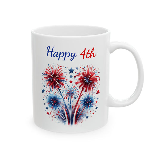 White ceramic coffee mug featuring red, white, and blue fireworks bursting in a heart-shaped arrangement with small scattered stars beneath the blue and red script text Happy 4th.
