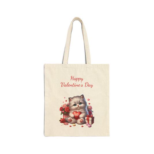 Canvas tote bag with a "Happy Valentine's Day" print featuring a cute kitten holding a heart, surrounded by roses and a gift box.

