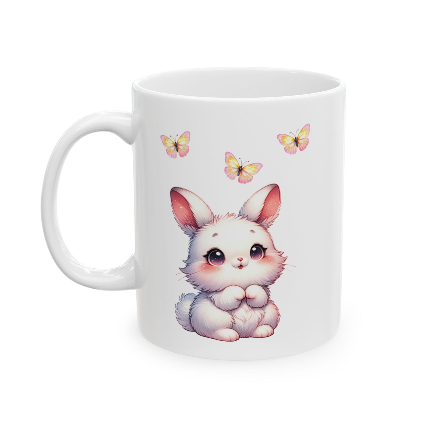 White ceramic mug with an adorable fluffy white cartoon bunny with pink ears and cheeks, sitting below three colorful pink and yellow butterflies.

