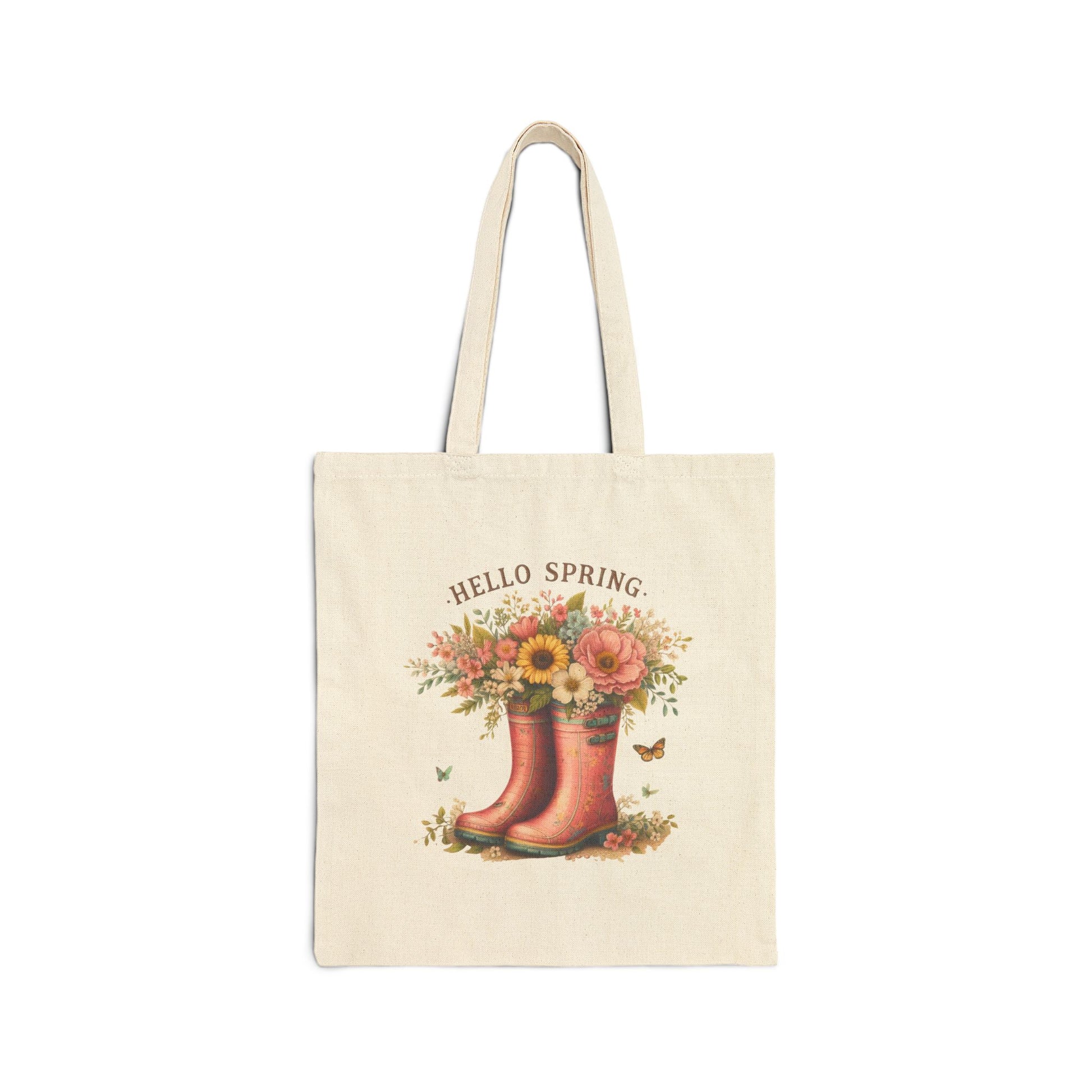 Canvas tote bag with a "Hello Spring" print featuring a pair of pink rain boots filled with a bouquet of flowers.