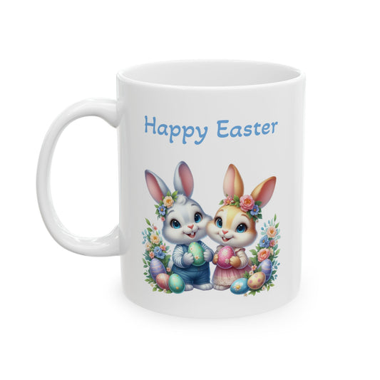 White ceramic mug with "Happy Easter" text, featuring two cute cartoon bunnies, a boy bunny and a girl bunny, surrounded by colorful flowers and painted Easter eggs.

