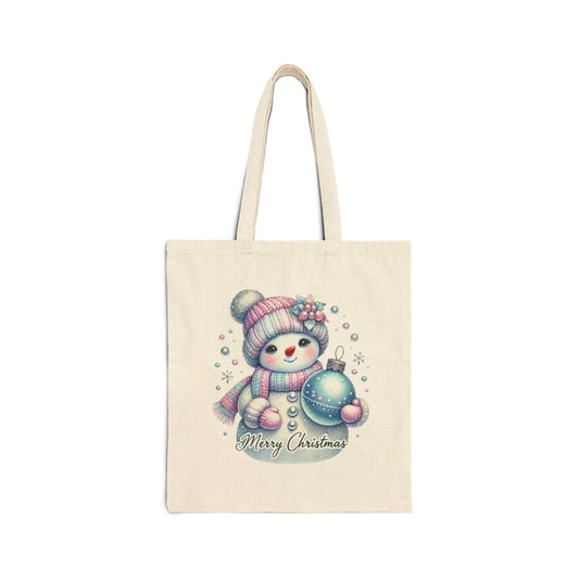 Canvas tote bag with a cute snowman holding a blue Christmas ornament