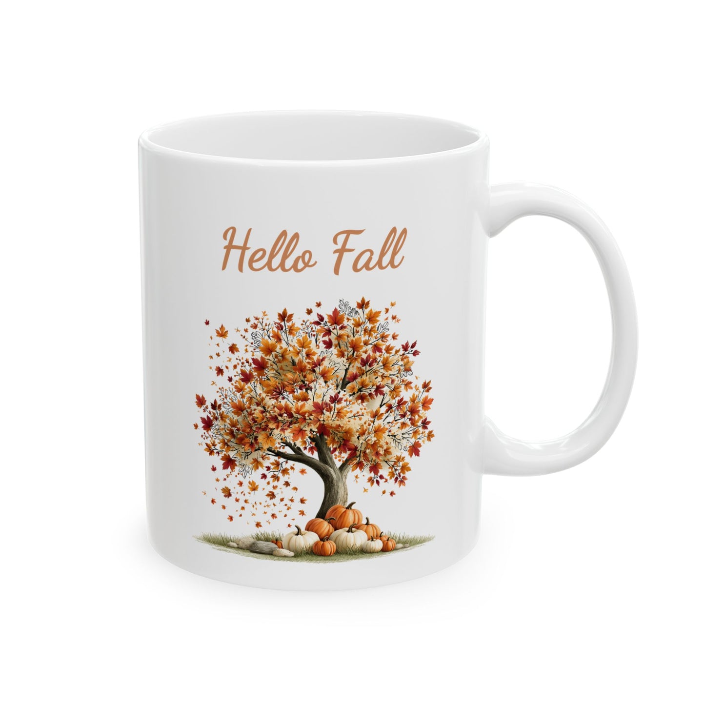 White ceramic mug featuring fall tree illustration beneath script text reading Hello Fall.
