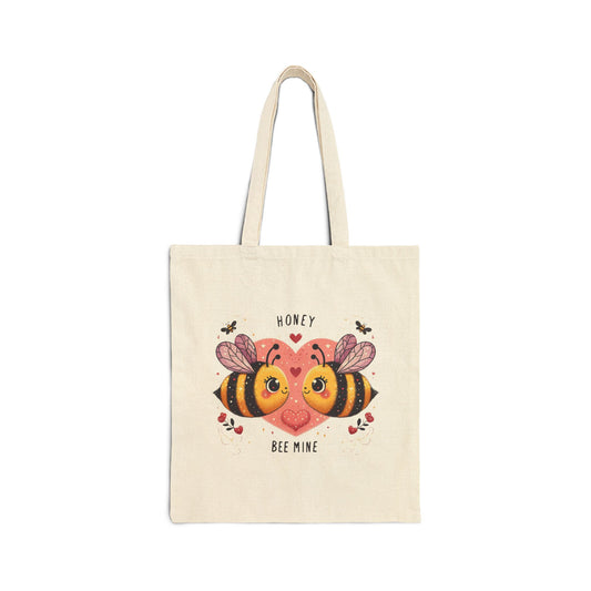 Canvas tote bag with a "Honey Bee Mine" print featuring two cute honey bees and a large pink heart.

