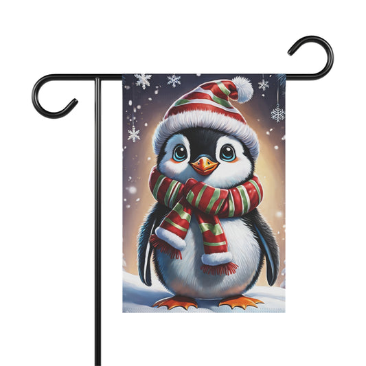 Cute cartoon penguin garden flag wearing a red and green striped Santa hat and scarf, with snowflakes, festive holiday outdoor decor.


