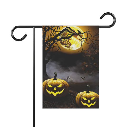 Two glowing jack-o'-lanterns in front of a full yellow moon with foggy graveyard and spooky trees on a Halloween garden flag