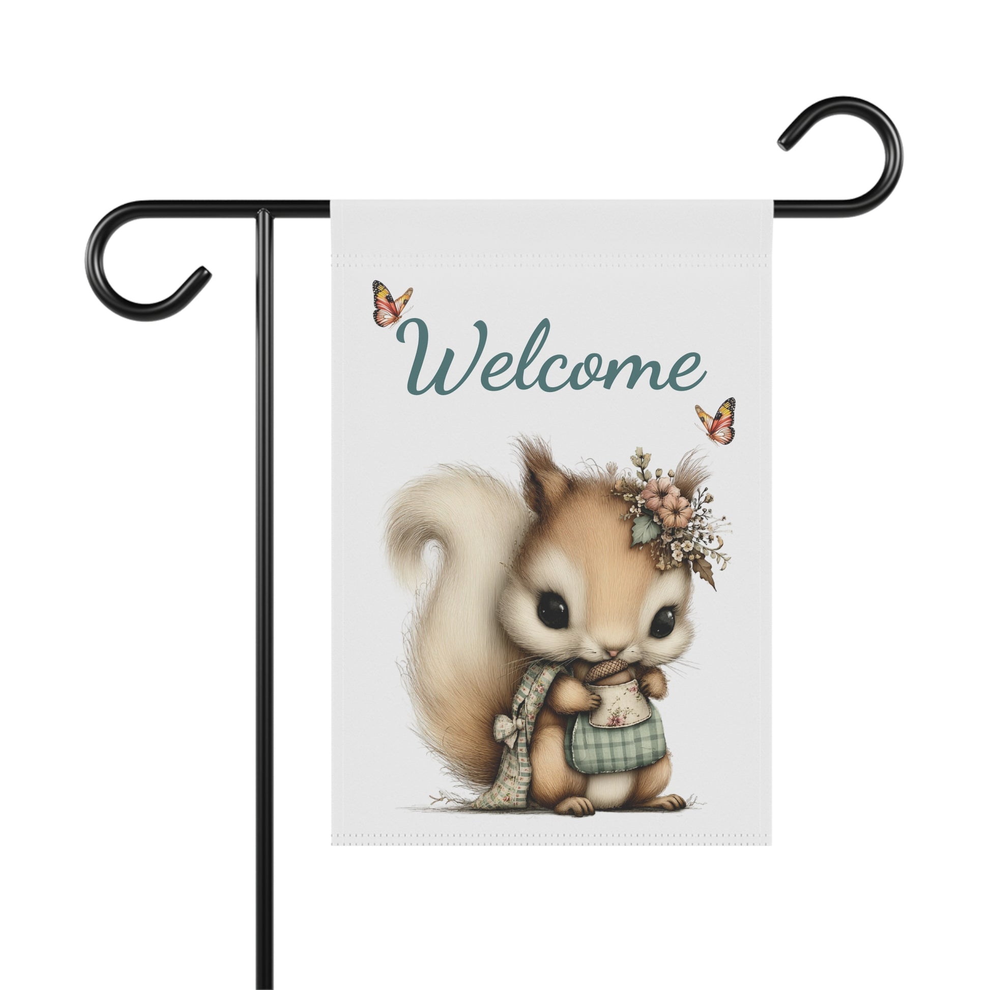 Garden flag on a black metal stand printed with teal script Welcome text and a cute squirrel holding an acorn with butterflies