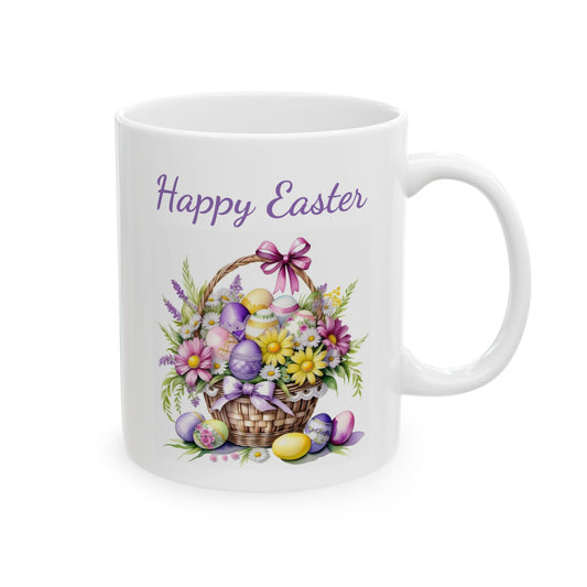 White ceramic coffee mug with a beautiful watercolor illustration of a wicker basket filled with colorful Easter eggs and a bouquet of yellow, pink, and purple flowers, with the words "Happy Easter" in elegant purple script text above it.


