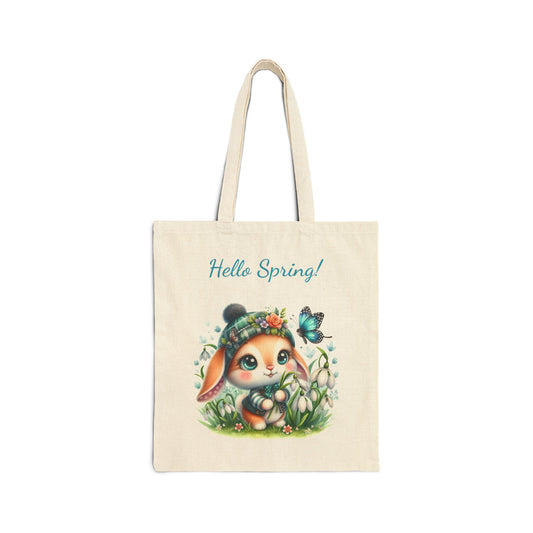 Canvas tote bag with a "Hello Spring!" print featuring an adorable bunny with big eyes and a hat, surrounded by flowers and a butterfly.