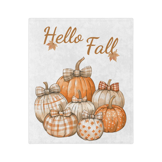 Lightweight velveteen blanket with "Hello Fall" text and two small leaves, featuring a group of patterned and solid orange pumpkins decorated with bows.

