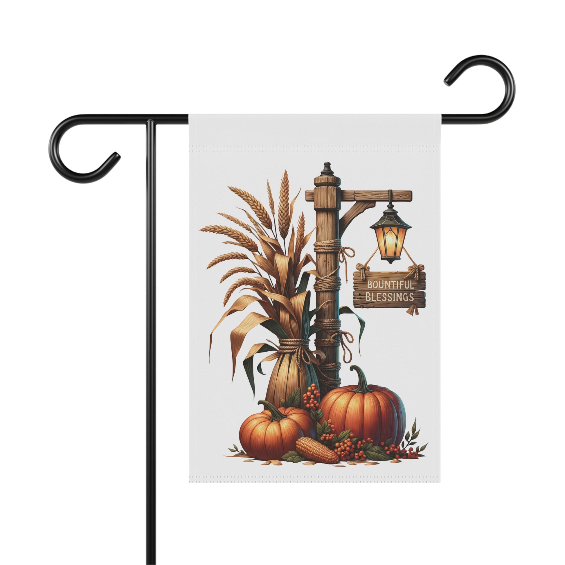 Whimsical autumn garden flag featuring a rustic wooden post wrapped in rope, a glowing lantern hanging with a Bountiful Blessings sign, a large bundle of wheat, and orange pumpkins with corn at the base.