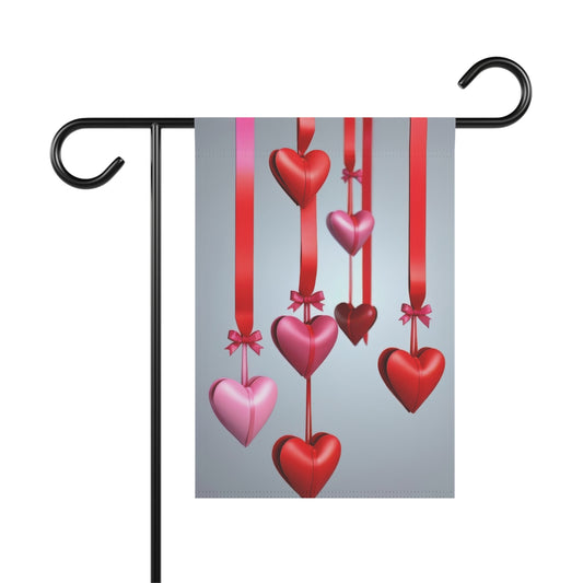 Valentine garden flag with red and pink 3D hearts hanging from red ribbons on gray background