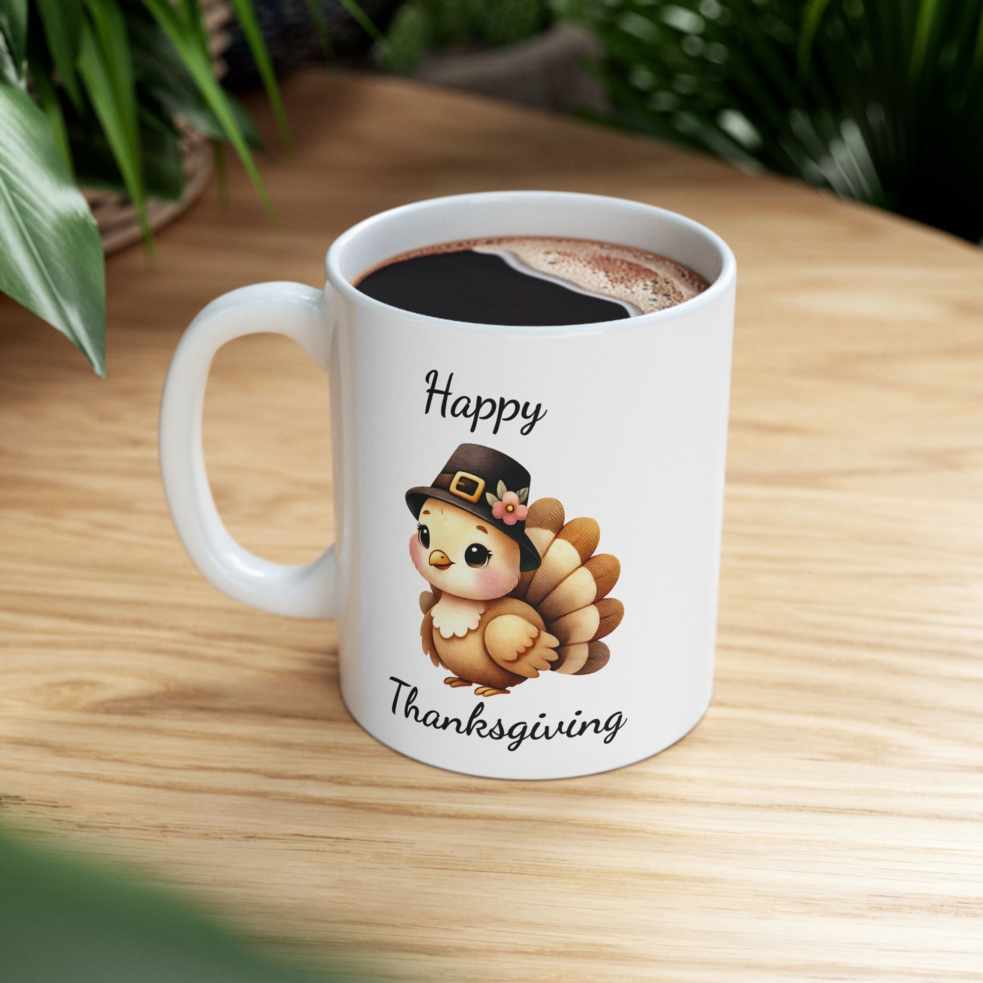 White ceramic coffee mug with 'Happy Thanksgiving' text and a cute cartoon turkey wearing a brown pilgrim hat decorated with a flower, against a plain background.