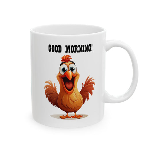 White ceramic coffee mug with a cartoon illustration of a cheerful, wide-eyed brown and orange chicken with an open beak, and bold black text above reads "GOOD MORNING!".