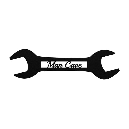 Black metal sign shaped like a wrench with the words "Man Cave" in the center.